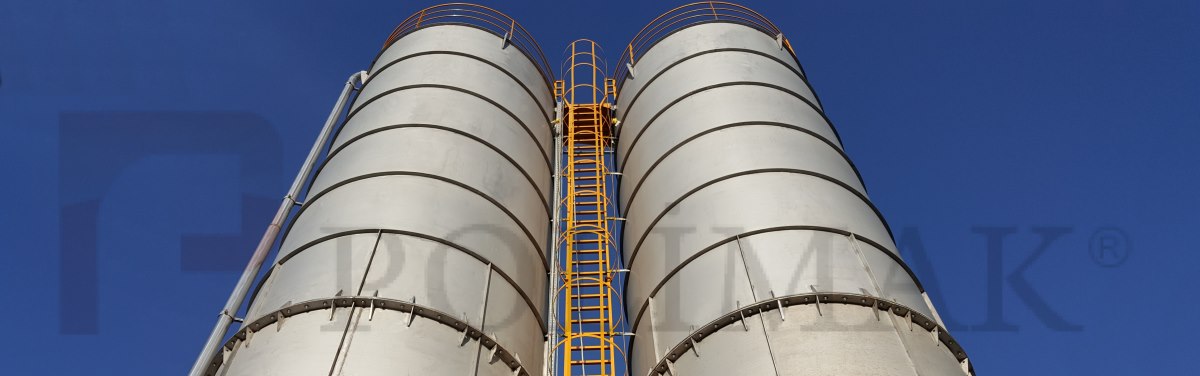 Stainless steel bulk material storage silos with ladder and pneumatic conveying pipeline
